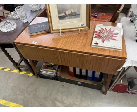 A vintage teak Formica top drop leaf kitchen table