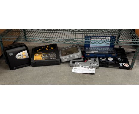 A quantity of cased tool sets including socket sets, soldering iron, bicycle tools &amp; electric car pump etc.