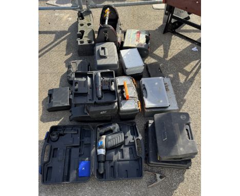 A quantity of toolboxes, some with contents including drills, a cordless screwdriver etc