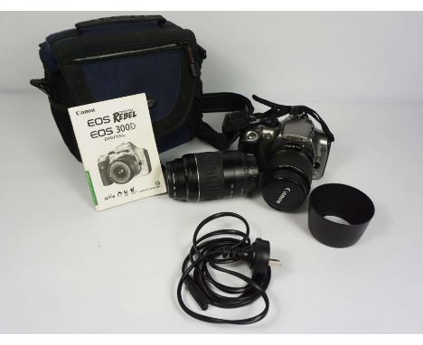 A Canon Eos 300D digital camera, including EFS 18-55mm &amp; EF 55-200 telephoto lenses, in a case with manual, charger and l