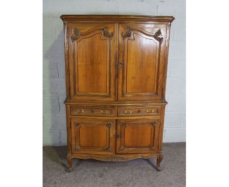 A compact walnut 18th century style armoire, Modern, with two moulded cabinet doors over two small drawers and a further pair