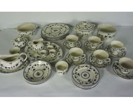 A Royal Doulton part dinner service, ‘Yorktown’ pattern, including a large oval serving dish, covered entree dish, tea cups, 