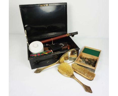 A tin box of assorted items including a decorative pewter trinket box, gilt decorated dressing set, assorted British and cont