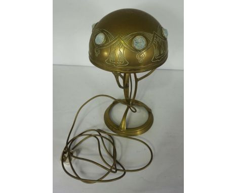 An Art Nouveau style brass table lamp, with opaque cabochons and brass shade, 43cm high Condition reportThe lamp appears to h