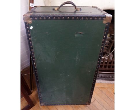 A vintage green metal bound trunk.