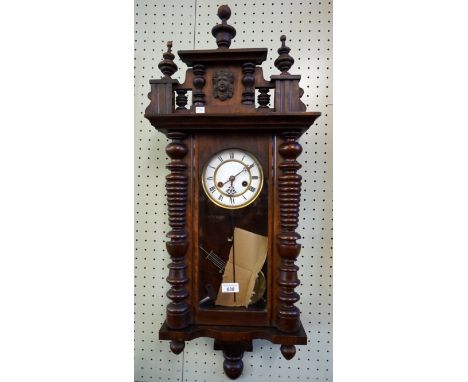 An early 20th Century stained wall clock.