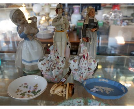 A mixed group of ceramic items to include a Nao Lladro figure of a girl holding a sheep, two continental ceramic figures mode