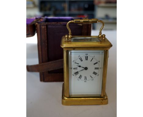A cased J W Henson brass bound carriage clock, a further carriage clock for spares and repairs, together with a Miles Suprex 
