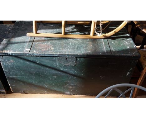 A substantial painted pine metal bound storage trunk.