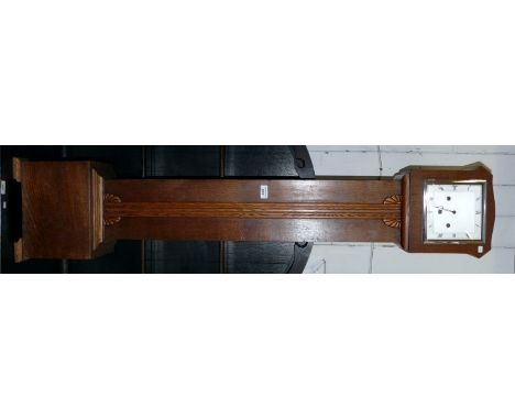 An Art Deco oak granddaughter clock.