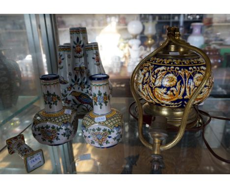 A group of French faience ware ceramic items to include a small pedestal, pair of squat form vases, posy vase and a lamp deco