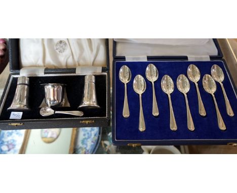 A Birmingham hallmarked silver cruet set, comprising pepperette, salt shaker and mustard pot, and a cased set of eight Sheffi