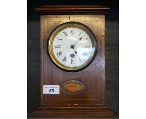 An Edwardian inlaid mahogany mantel clock of rectangular form.