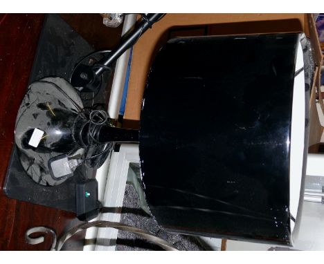 A stylish black metal reading lamp together with a table top black finished lamp.