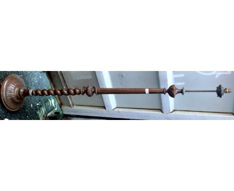 A mid 20th Century carved standard lamp, raised on barley twist support.