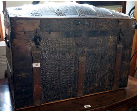 A Vintage crocodile skin effect dome topped travelling trunk.