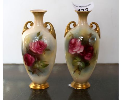 A pair of miniature Royal Worcester twin handled ovoid form vases, decorated with hand painted rose design (2).