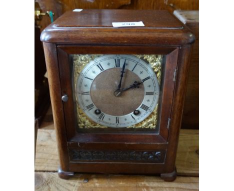 An Edwardian mahogany cased mantel clock.