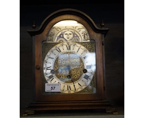 A good quality reproduction mahogany cased mantel clock, raised on bracket supports.