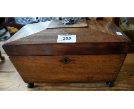 A Victorian mahogany tea caddy.