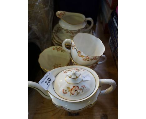 A Royal Crown Derby tea service decorated with roses, together with two cased sets of Edinburgh crystal glassware.