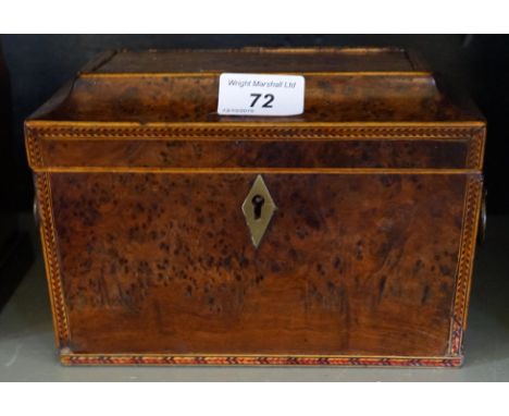 A Victorian inlaid burr walnut tea caddy, the cover enclosing two fitted sections.