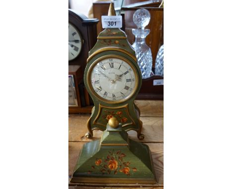 A reproduction Mira green painted bracket clock and bracket.
