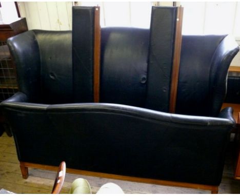 A reproduction French style king size black leatherette bed frame.