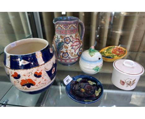A mixed group of ceramic items to include a Moorcroft Clematis pattern pin dish, a Charlotte Rhead ovoid form jug with loop h