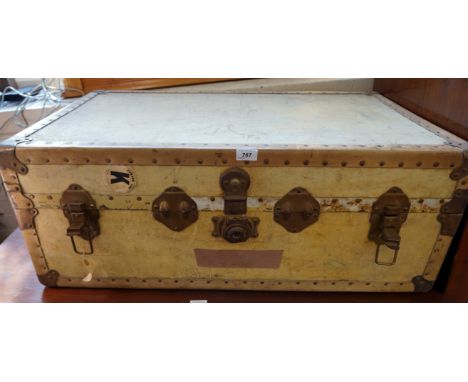 A Vintage cream decorated metal bound trunk with original label for Cunard Line.