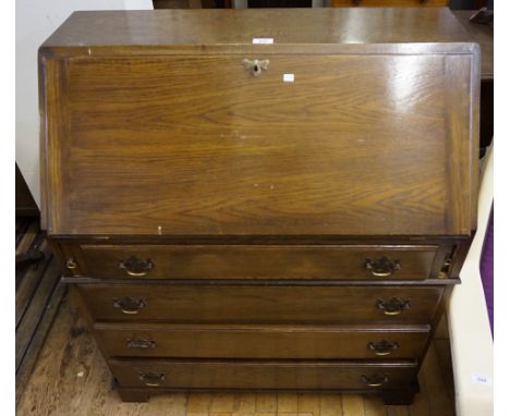 A reproduction oak bureau of small proportions, having four drawers, raised on bracket feet.