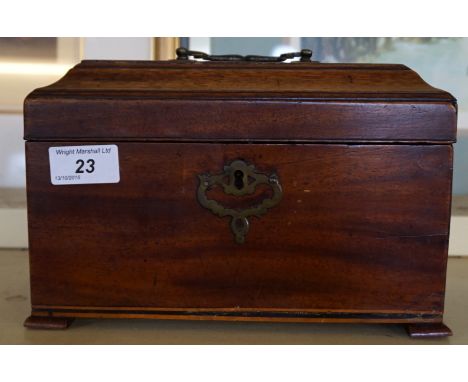 A George III mahogany tea caddy raised on four bracket feet.