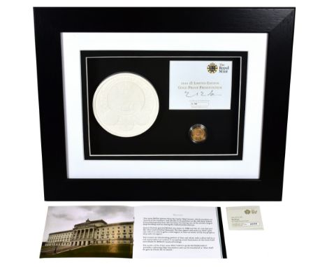 g Elizabeth II (1952-), gold Proof One Pound Coin, 2010, in presentation picture frame with plaster cast of the Belfast rever