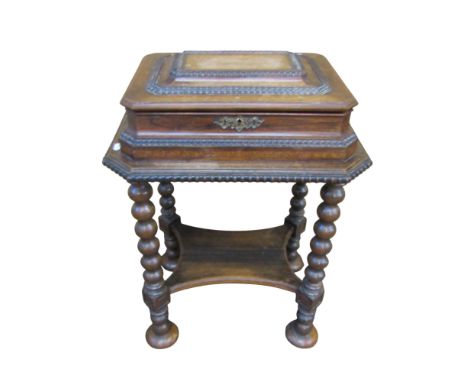 A Dutch Colonial rosewood sewing table with rising lid, raised on an open framework with bobbin moulded detail, 75cm high x 5