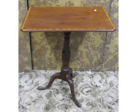 A 19th century mahogany tripod table with turned pillar beneath a probably associated rectangular top with satinwood crossban