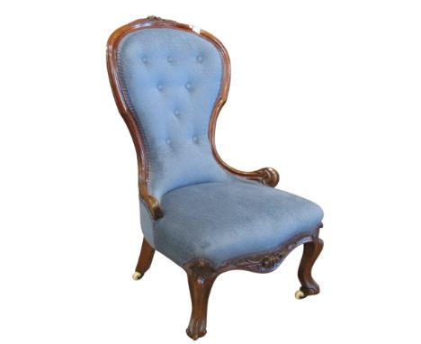 A Victorian ladies drawing room chair with blue upholstered seat, button back within showwood frame