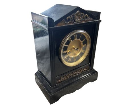 A Victorian black slate mantle / table clock, of architectural form, the dial marked ‘Cahoon Bros, Belfast’.