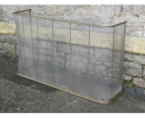 A 19th century wirework fire fender with simple brass rail and curb 69 cm high x 120 cm wide approx 