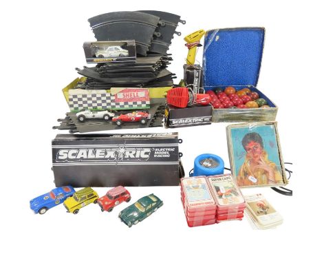 A selection of Scalextric track, various Scalextric cars, hand throttles, a transformer, together with a set of vintage snook