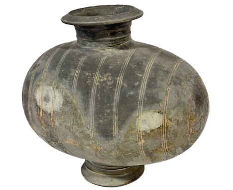 A Chinese Han dynasty style cocoon pottery wine vessel with banded detail 35cm high. 