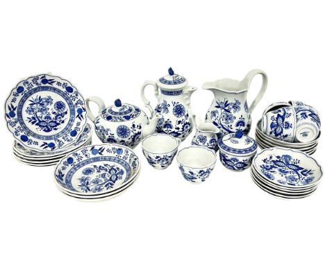 A Hutschenreuther blue and white ‘Blue Onion’ pattern porcelain breakfast service for six to include tea and coffee pots, mil