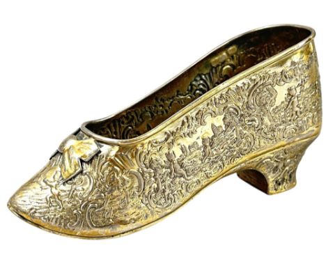 An early 20th century novelty John George Piddington Dutch silver shoe of 18th century design with fully embossed decoration 