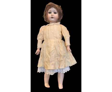 Early 20th century bisque head doll by Welsh &amp; Company with head by Max Oscar Arnold mould no 200; doll has closing brown