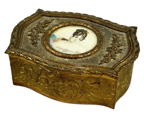 19th century cast brass trinket box with serpentine outline, the lid enclosing a portrait miniature, thought to be ‘Mme de Ge