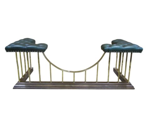 A traditional club fender with green buttoned leather upholstered corner seats, brass rails and moulded oak curb, 54 cm high 