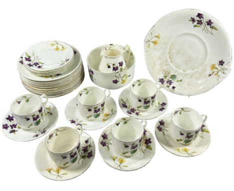 A Victorian porcelain tea service, decorated with violets, primroses, etc