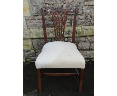A Georgian mahogany single chair in the Chippendale stye with Gothic tracery pierced splat and upholstered seat 
