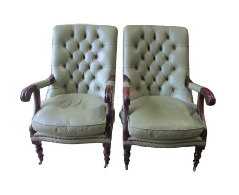 A pair of Victorian style drawing room chairs, upholstered in pale green leather with buttoned backs