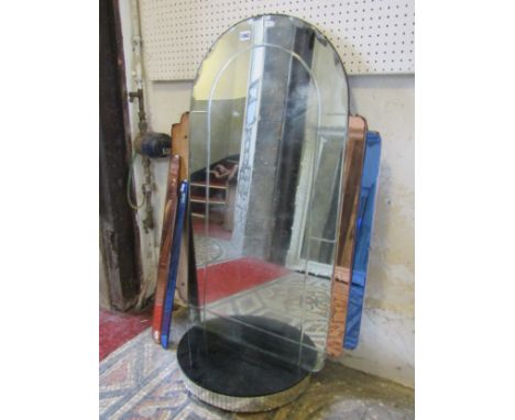 An Art Deco mirror of stepped arched form with segmented plates and bow fronted shelf, 104cm x 68cm