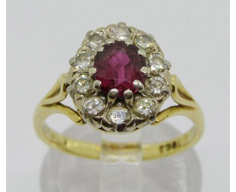 18ct ruby and diamond oval cluster ring, ruby 6 x 5mm approx, diamonds 0.05ct each approx, size O, 4.4g